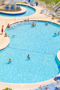 Outdoor pool with oceafront views at Sea Watch Resort